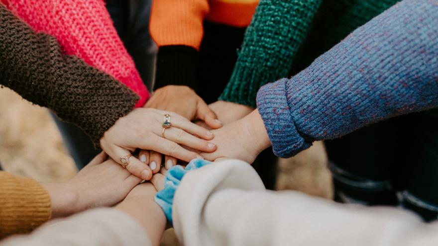 Hands placed on top of each other